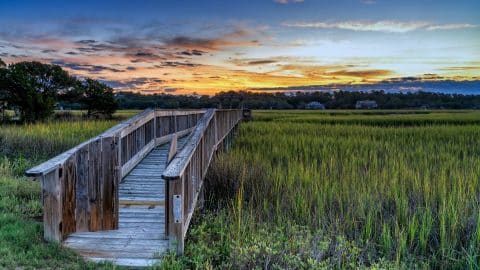 wooden dock on the inlet at Pawleys Island in South Carolina at usnset